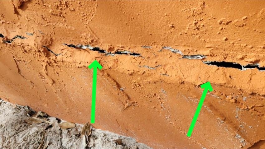 Showing a picture of a crack in the concrete